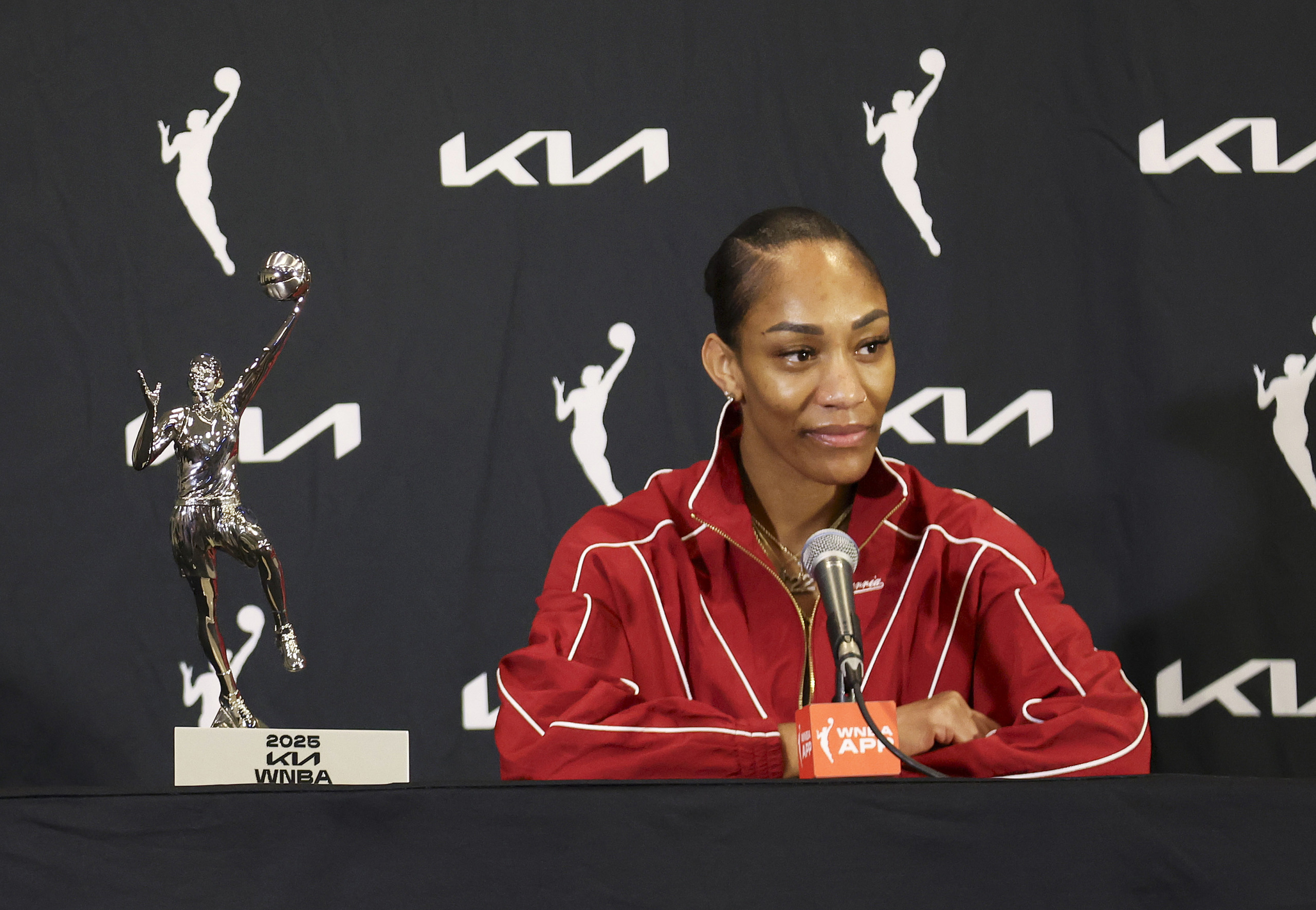 A'ja Wilson recieving her 4th MVP award at press conference.