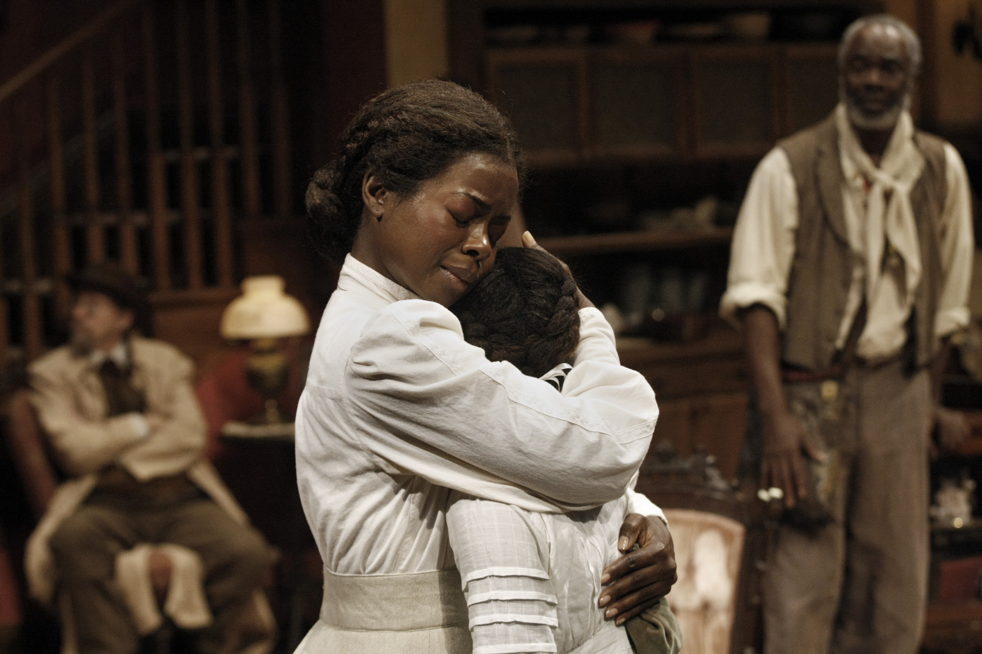 Erica Tazel holds Skye Barrett in a dress rehearsal of August Wilson's "Joe Turner's Come and Gone"