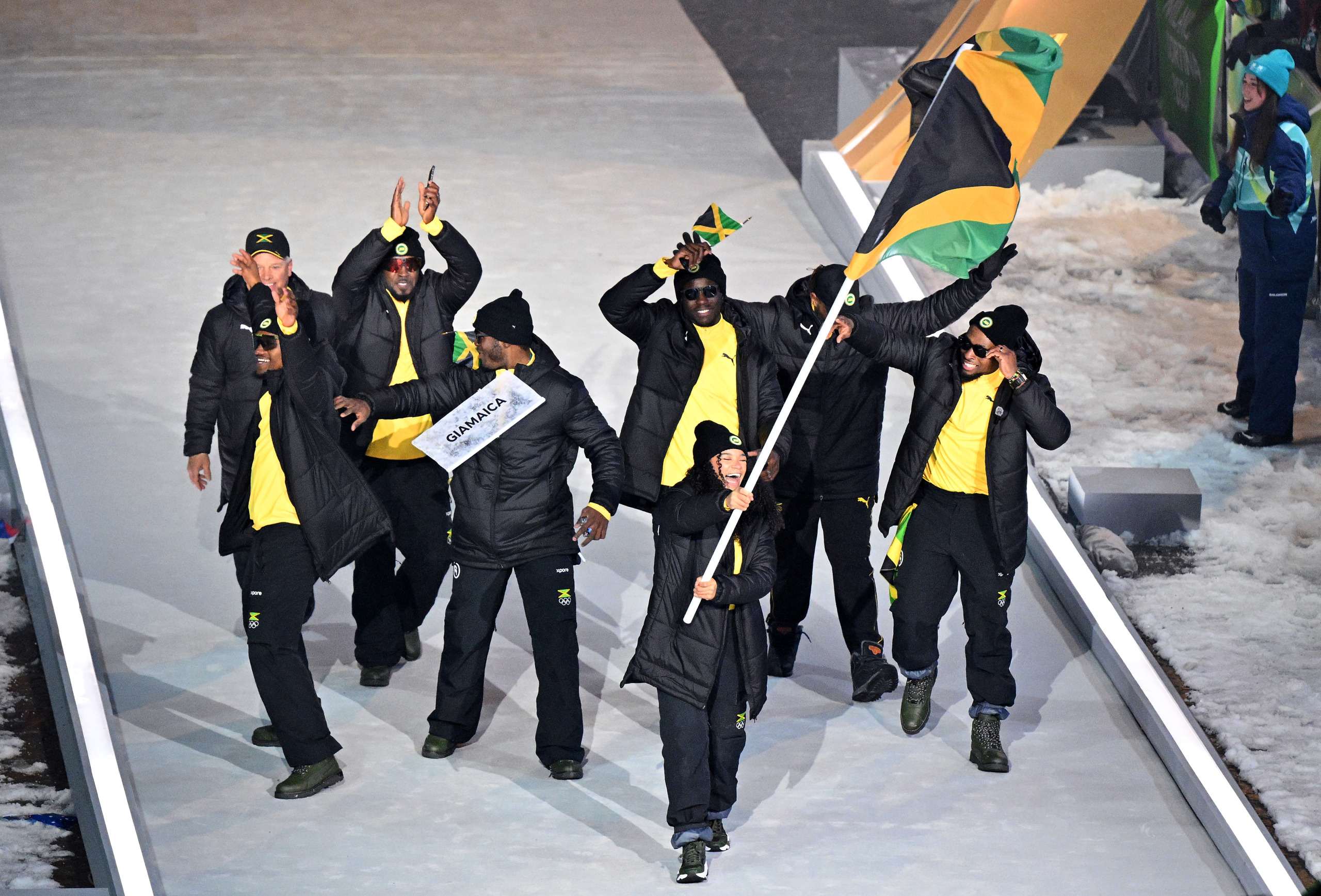 Flagbearer Mica Moore of Team Jamaica during the opening ceremony of the Milano Cortina 2026 Winter Olympics. 