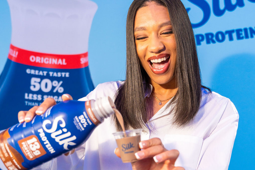 Aerial Powers pours Silk Protein shake