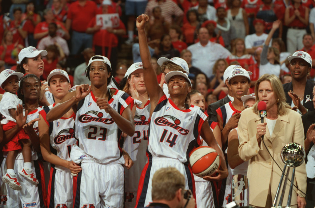 Cynthia Cooper and the Houston Comets celebrate win their third straight WNBA Championship. 