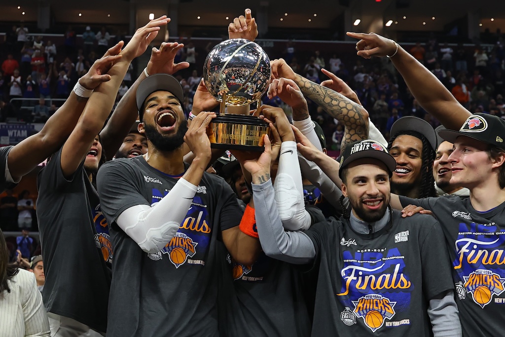 The New York Knicks celebrate with the Bob Cousy Trophy after defeating the Cleveland Cavaliers 130-93 in Game Four of the NBA Eastern Conference Finals at Rocket Arena on May 25, 2026 in Cleveland, Ohio.
