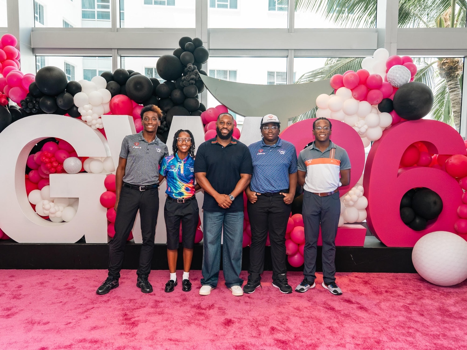 Clifton Addison with Fore Life students: Fabian Harris, Royce Jones, Faraji Harris and Floyd Harris | Credit: courtesy Urban Golf Foundation
