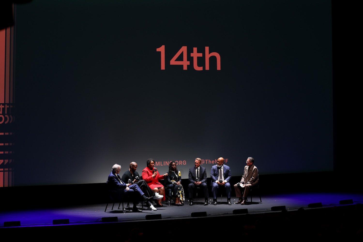 David W. Blight, Van Lathan, Stacey Abrams, Sherrilyn Ifill, Jeff Flake, Paul Garnes and Dennis Lim onstage for Netflix's 14th  | Credit: 